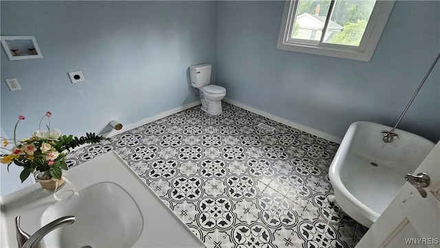 726 S Main St, Shelby, NY 14103 - full bath featuring a freestanding bath and tile patterned floors