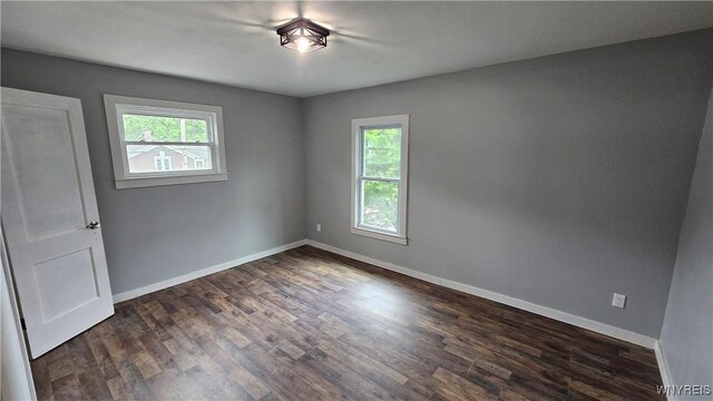 726 S Main St, Shelby, NY 14103 - unfurnished room with dark wood-style flooring and baseboards