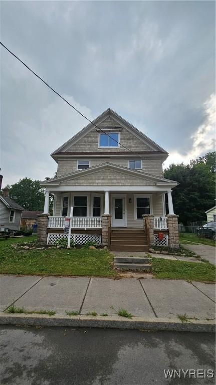 726 S Main St, Shelby, NY 14103 - view of front of house with a porch