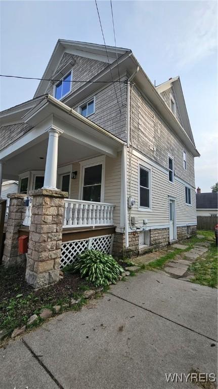 726 S Main St, Shelby, NY 14103 - view of side of property with a porch