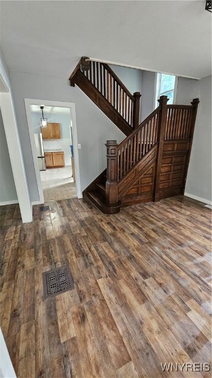 726 S Main St, Shelby, NY 14103 - stairway with wood finished floors