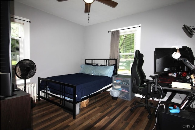 218 S Terry Rd, Geddes, NY 13219 - bedroom with radiator, wood finished floors, multiple windows, and a desk