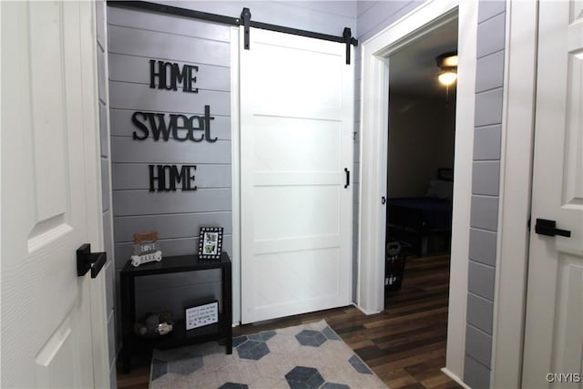 218 S Terry Rd, Geddes, NY 13219 - hallway with dark wood finished floors and a barn door