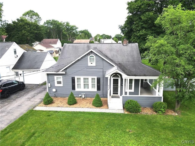 218 S Terry Rd, Geddes, NY 13219 - view of front facade with a front lawn, a chimney, and a shingled roof