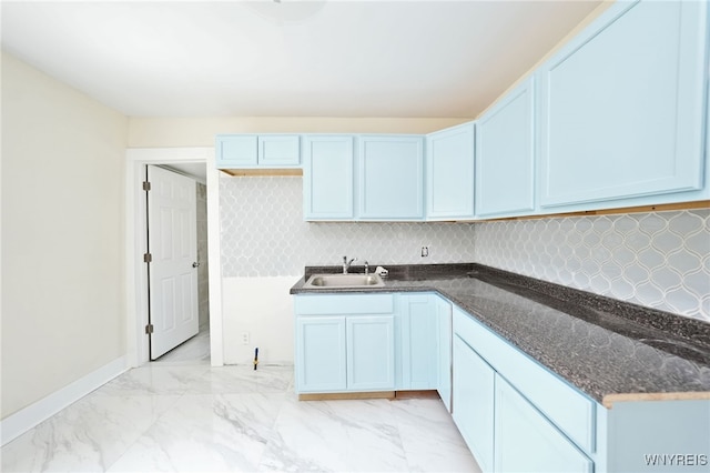 50 Avery Pl, Cheektowaga, NY 14225 - kitchen featuring light marble finish floors, dark stone counters, and tasteful backsplash