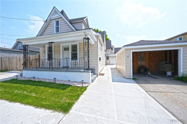 50 Avery Pl, Cheektowaga, NY 14225 - view of front of property featuring covered porch, a garage, and concrete driveway