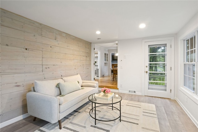 100 Carverdale Dr, Brighton, NY 14618 - living room featuring light wood finished floors, recessed lighting, and wood walls