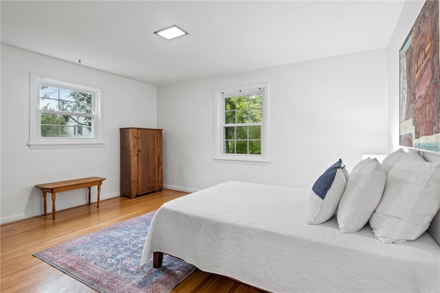 100 Carverdale Dr, Brighton, NY 14618 - bedroom with multiple windows and wood finished floors