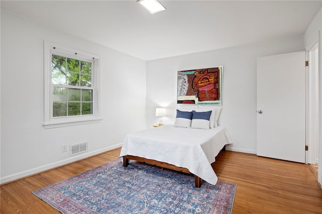 100 Carverdale Dr, Brighton, NY 14618 - bedroom featuring wood finished floors and baseboards
