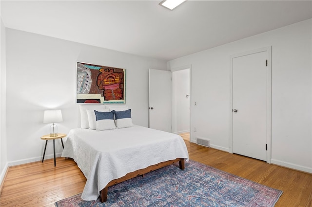 100 Carverdale Dr, Brighton, NY 14618 - bedroom featuring wood finished floors and baseboards