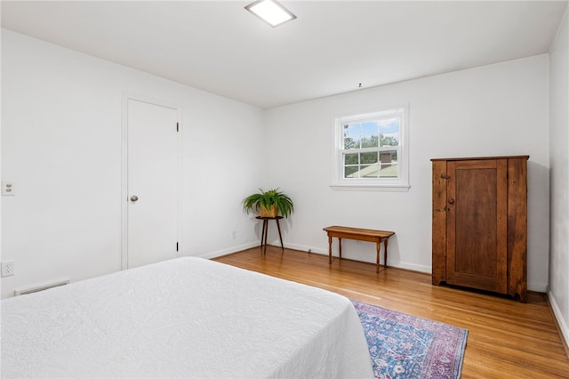100 Carverdale Dr, Brighton, NY 14618 - bedroom featuring light wood-style floors and baseboards