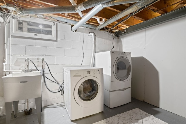 100 Carverdale Dr, Brighton, NY 14618 - washroom featuring washer and dryer and concrete block wall