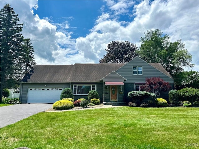 1000 Sherman Dr, Utica, NY 13501 - traditional-style home featuring a garage, asphalt driveway, and a front yard