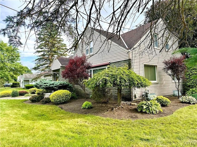 1000 Sherman Dr, Utica, NY 13501 - view of side of property featuring a lawn