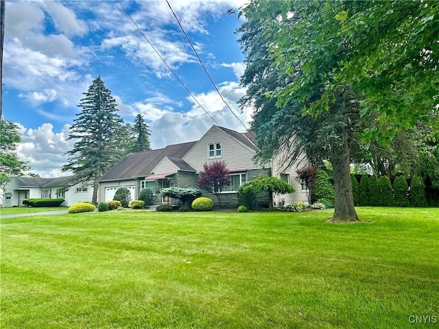 1000 Sherman Dr, Utica, NY 13501 - view of front facade featuring an attached garage and a front lawn