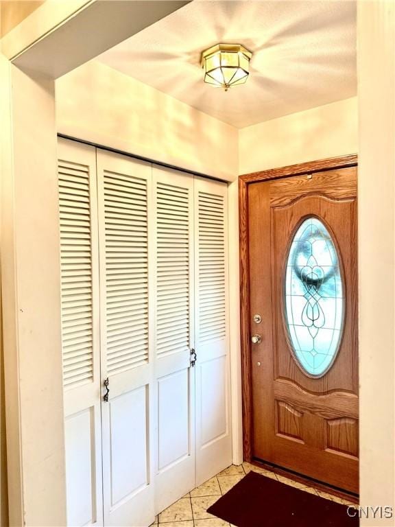 1000 Sherman Dr, Utica, NY 13501 - entrance foyer featuring light tile patterned floors