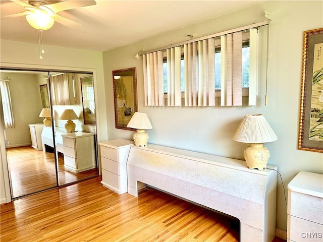 1000 Sherman Dr, Utica, NY 13501 - living area with wood finished floors and a ceiling fan