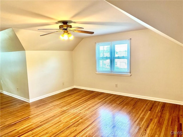 1000 Sherman Dr, Utica, NY 13501 - additional living space with vaulted ceiling, a ceiling fan, and wood finished floors
