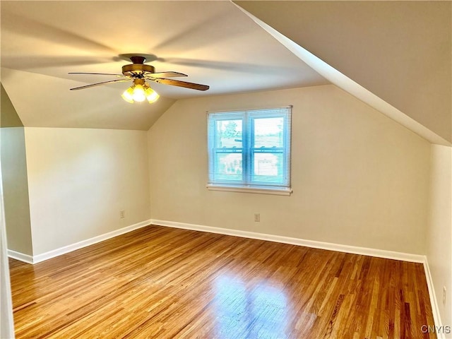 1000 Sherman Dr, Utica, NY 13501 - additional living space with vaulted ceiling, ceiling fan, and wood finished floors