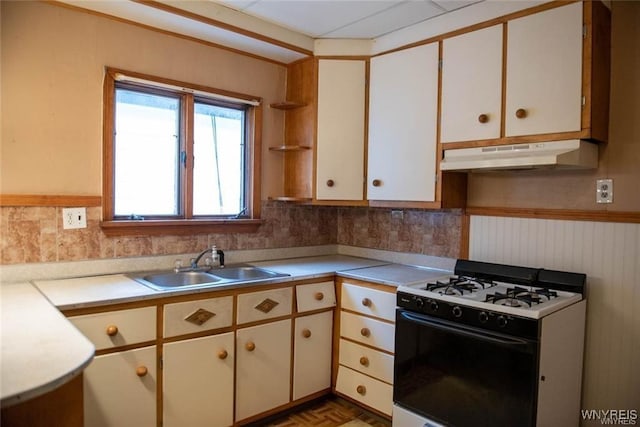 150 Weiss St, Buffalo, NY 14206 - kitchen featuring white gas range, under cabinet range hood, light countertops, open shelves, and wainscoting