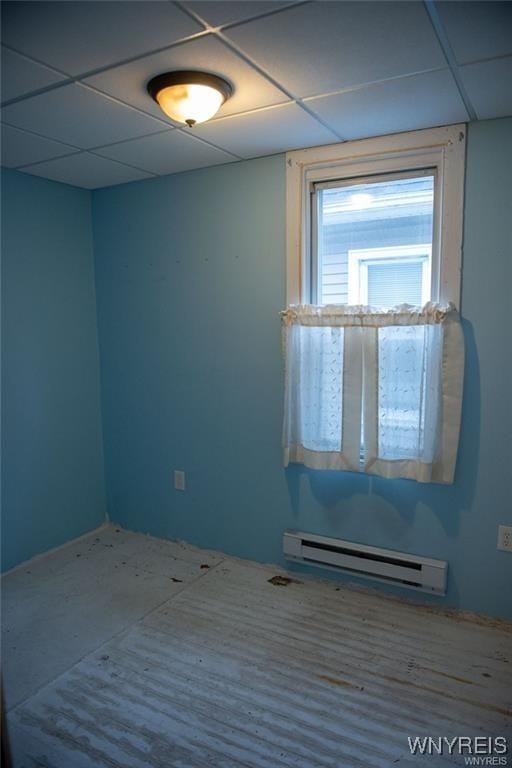 150 Weiss St, Buffalo, NY 14206 - unfurnished room with baseboard heating and a paneled ceiling