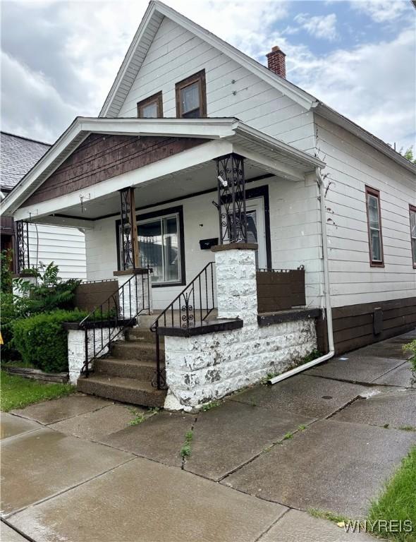 150 Weiss St, Buffalo, NY 14206 - view of front of home with a chimney and covered porch