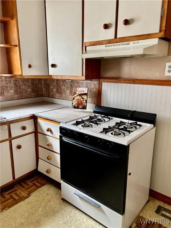 150 Weiss St, Buffalo, NY 14206 - kitchen featuring white range with gas stovetop, light countertops, open shelves, under cabinet range hood, and backsplash