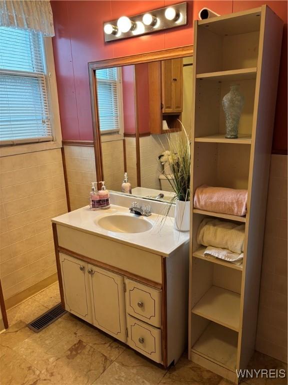 150 Weiss St, Buffalo, NY 14206 - bathroom with vanity and tile walls