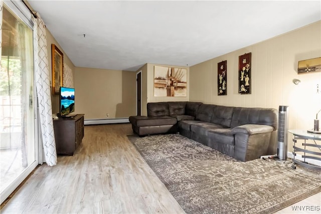 2503 Parkview Dr, Niagara Falls, NY 14305 - living room with baseboard heating, wood finished floors, and healthy amount of natural light