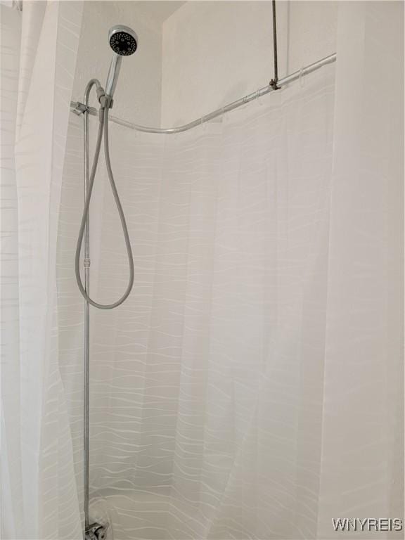 2255 Ontario Ave, Niagara Falls, NY 14305 - bathroom view of a shower with curtain