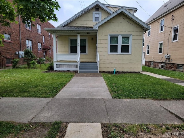 2255 Ontario Ave, Niagara Falls, NY 14305 - view of front of home with covered porch and a front lawn