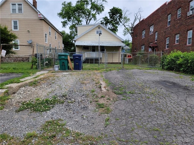 2255 Ontario Ave, Niagara Falls, NY 14305 - back of house with a gate and asphalt driveway