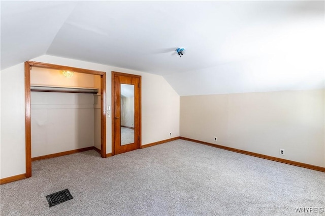 192 Culver Rd, Buffalo, NY 14220 - unfurnished bedroom with vaulted ceiling, carpet, and a closet