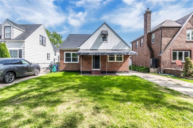 192 Culver Rd, Buffalo, NY 14220 - view of front of house featuring brick siding, a front yard, and board and batten siding
