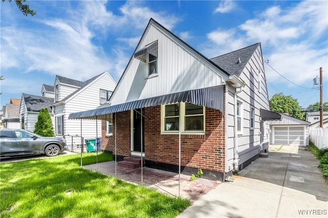 192 Culver Rd, Buffalo, NY 14220 - view of front facade featuring entry steps, brick siding, a garage, and an outdoor structure