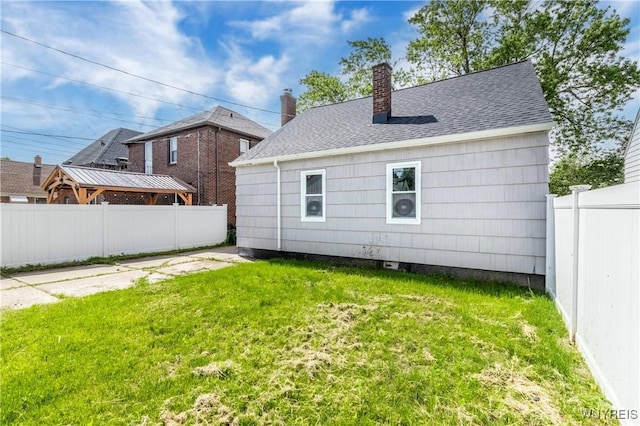 192 Culver Rd, Buffalo, NY 14220 - rear view of property with a chimney, a fenced backyard, and a shingled roof