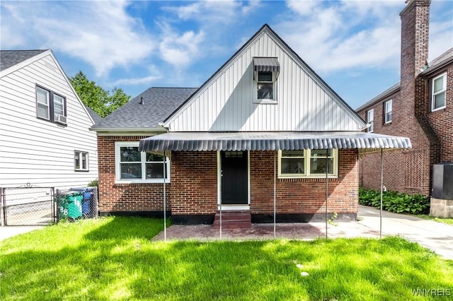 192 Culver Rd, Buffalo, NY 14220 - rear view of house with board and batten siding, entry steps, brick siding, a gate, and a shingled roof