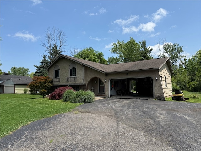 205 Darla Dr, Clarkson, NY 14420 - view of front of property with driveway, an attached garage, a front lawn, and stucco siding