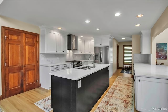 6290 Emily Ct, Clarence, NY 14032 - kitchen featuring wall chimney range hood, appliances with stainless steel finishes, light countertops, light wood-style flooring, and recessed lighting