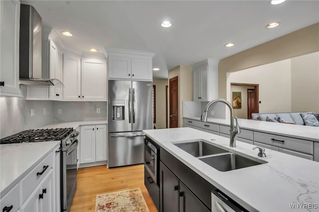 6290 Emily Ct, Clarence, NY 14032 - kitchen featuring stainless steel appliances, wall chimney exhaust hood, recessed lighting, light wood-type flooring, and white cabinetry