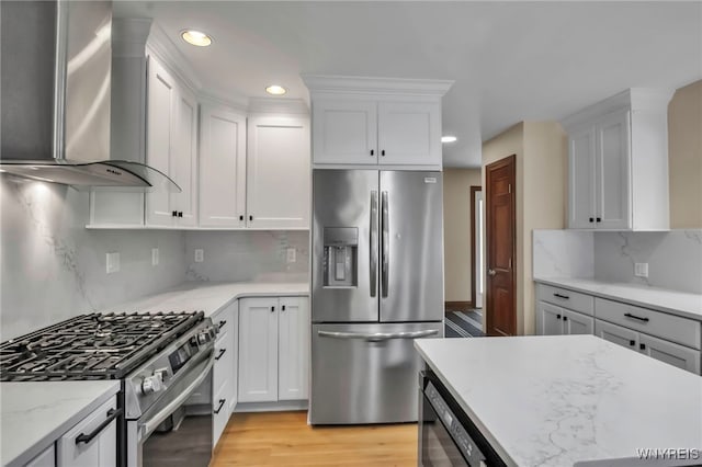 6290 Emily Ct, Clarence, NY 14032 - kitchen with appliances with stainless steel finishes, wall chimney range hood, recessed lighting, white cabinets, and tasteful backsplash