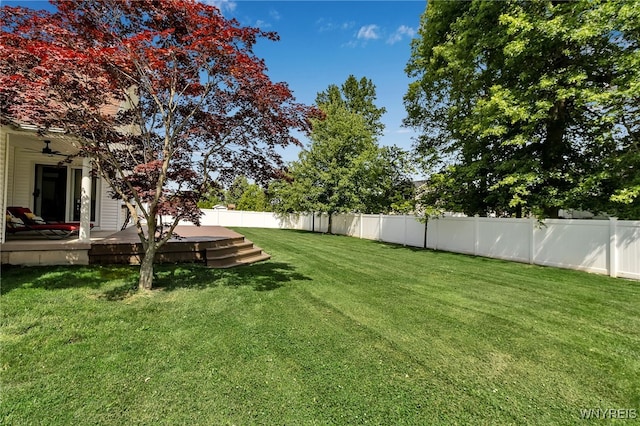 6290 Emily Ct, Clarence, NY 14032 - fenced backyard with a wooden deck and a ceiling fan