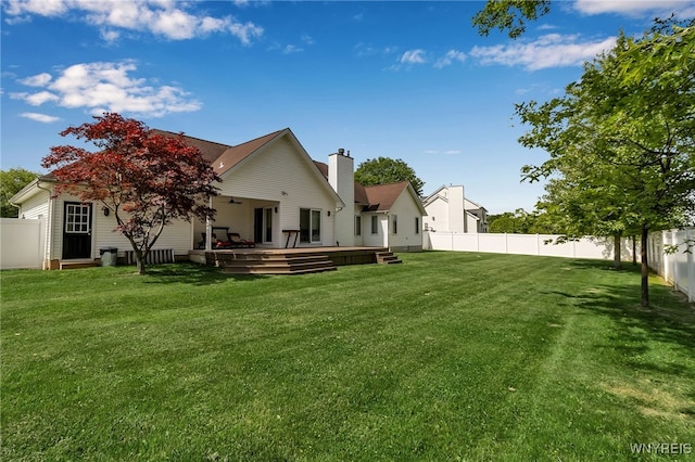 6290 Emily Ct, Clarence, NY 14032 - rear view of house with a fenced backyard, a chimney, and a wooden deck