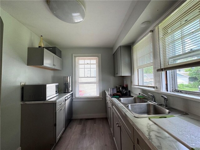 714 Arnett Blvd, Rochester, NY 14619 - kitchen with dark wood-style flooring, dishwasher, gray cabinets, and light countertops