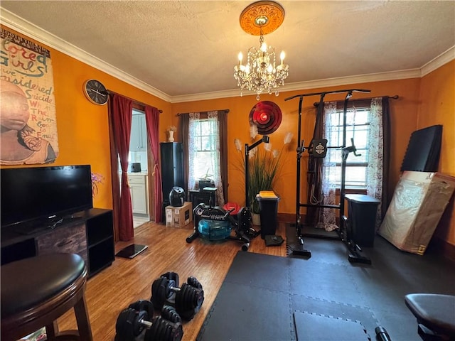 714 Arnett Blvd, Rochester, NY 14619 - exercise area featuring a textured ceiling, crown molding, and a chandelier