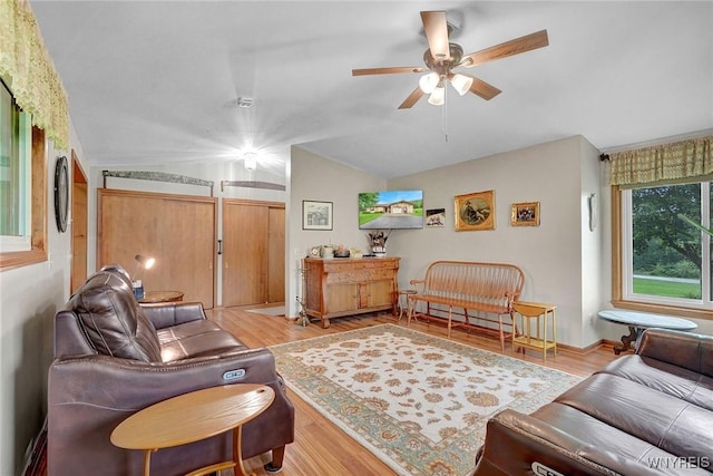 6557 Boberg Rd, Ashford, NY 14171 - living room with lofted ceiling, a ceiling fan, and wood finished floors