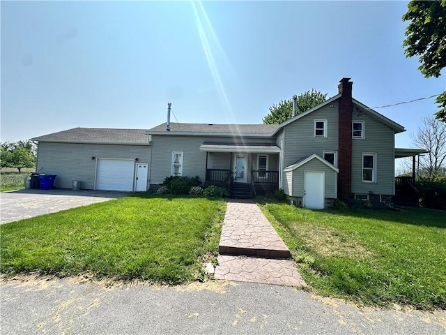 14918 Lakeshore Rd, Carlton, NY 14477 - view of front of home featuring a garage, a front yard, covered porch, and driveway