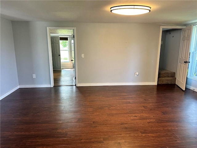 14918 Lakeshore Rd, Carlton, NY 14477 - empty room featuring dark wood-type flooring and stairs
