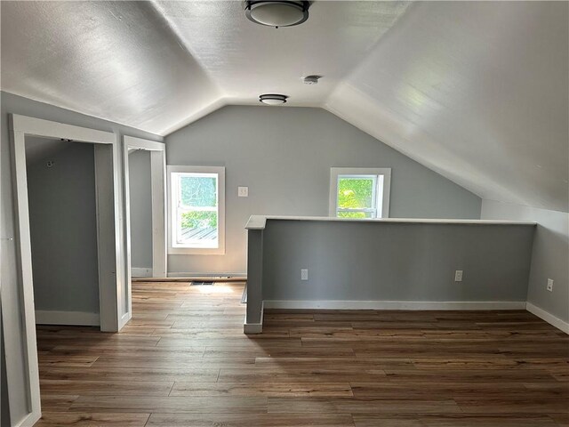 14918 Lakeshore Rd, Carlton, NY 14477 - additional living space featuring vaulted ceiling and hardwood / wood-style floors