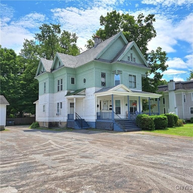 47 Miner Ave, Camden, NY 13316 - victorian house with covered porch and a chimney